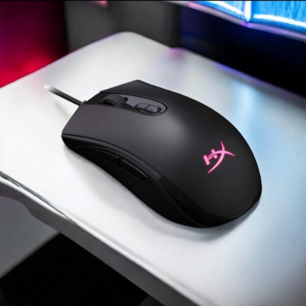 HyperX Pulsefire Core RGB Gaming Mouse retail box on desk setup with RGB background