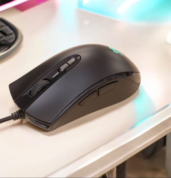 HyperX Pulsefire Core RGB Gaming Mouse retail box on desk setup with RGB background