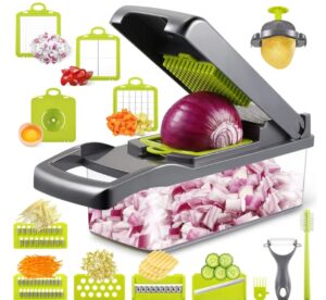 Close-up of a 14-in-1 professional vegetable chopper with green accents, showing various stainless steel blades and a clear collection container for dicing onions and slicing vegetables.