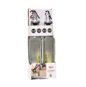 Two 250ml clear glass oil and vinegar dispenser bottles with silver pour spouts in retail packaging.